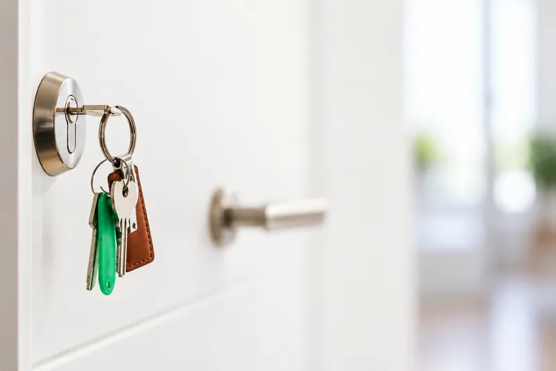 Keys hanging from a front door lock — locksmith Burien WA
